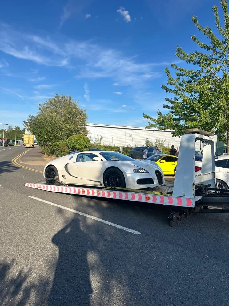 Bugatti Veyron loaded on a flatbed recovery truck
